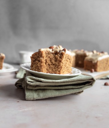 Slice of Easy Coffee Cake Recipe on a plate with a green napkin