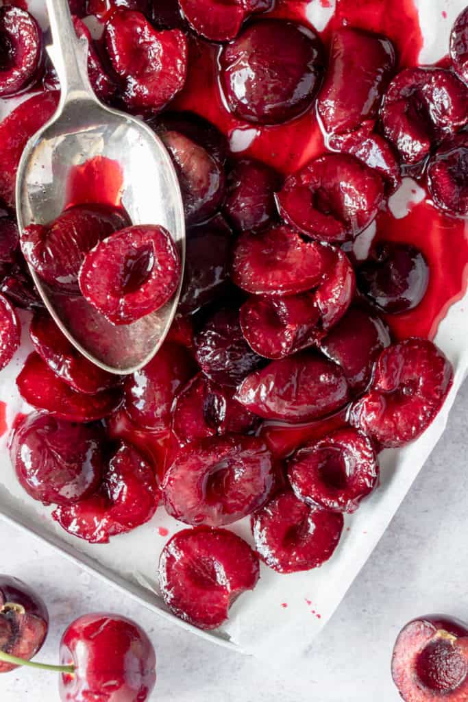 Roasted cherries on a tray for no-churn ice cream.
