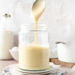 Cream in a jar with a spoon