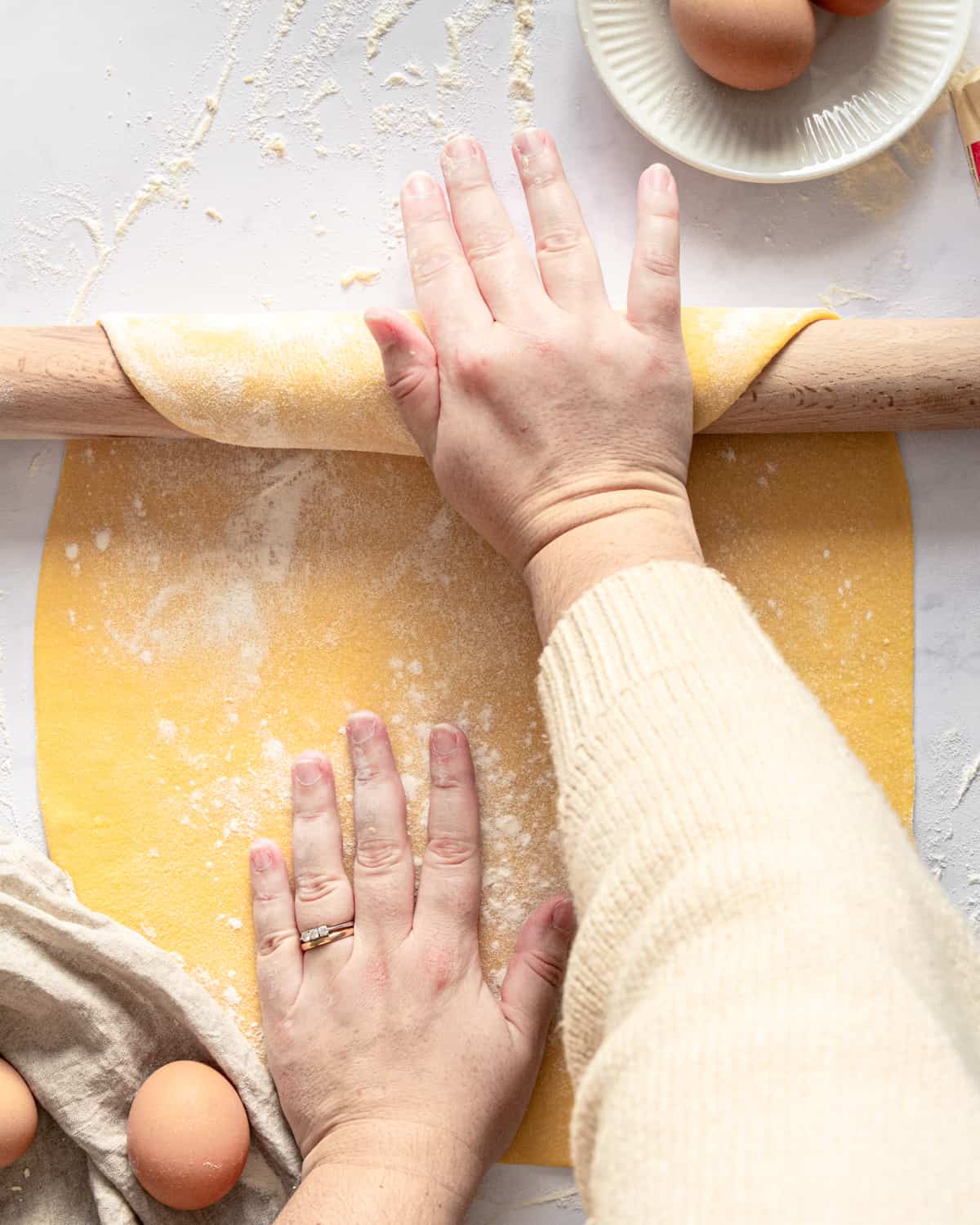 Rolling the dough  with the rolling pin 