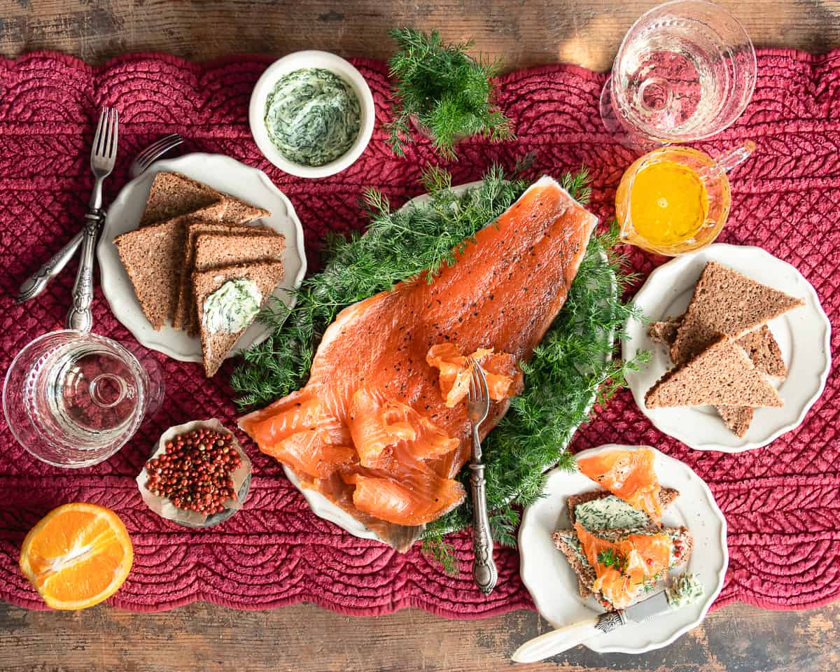 cured salmon recipe on a serving tray with toasted bread and herbs butter 