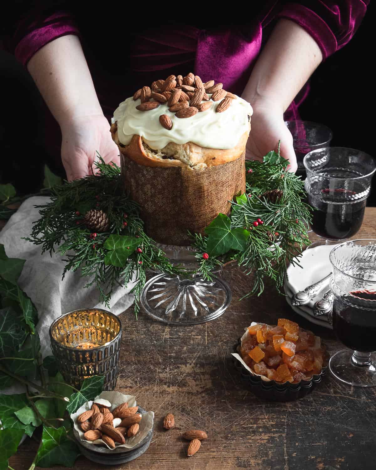 Italian Christmas cake recipe with hands holding it 