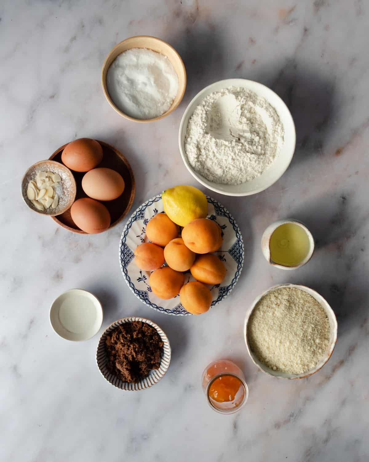 Ingredients on bowls for making  Italian almond cake recipe.