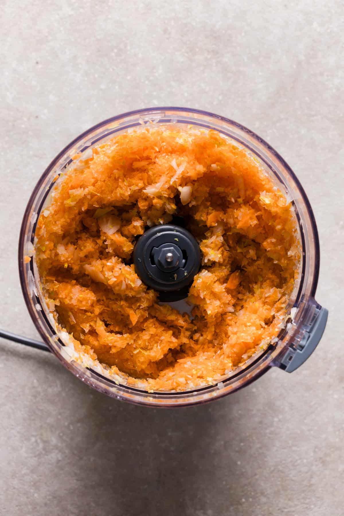 Shredded carrot, celery and onion in a food processor.