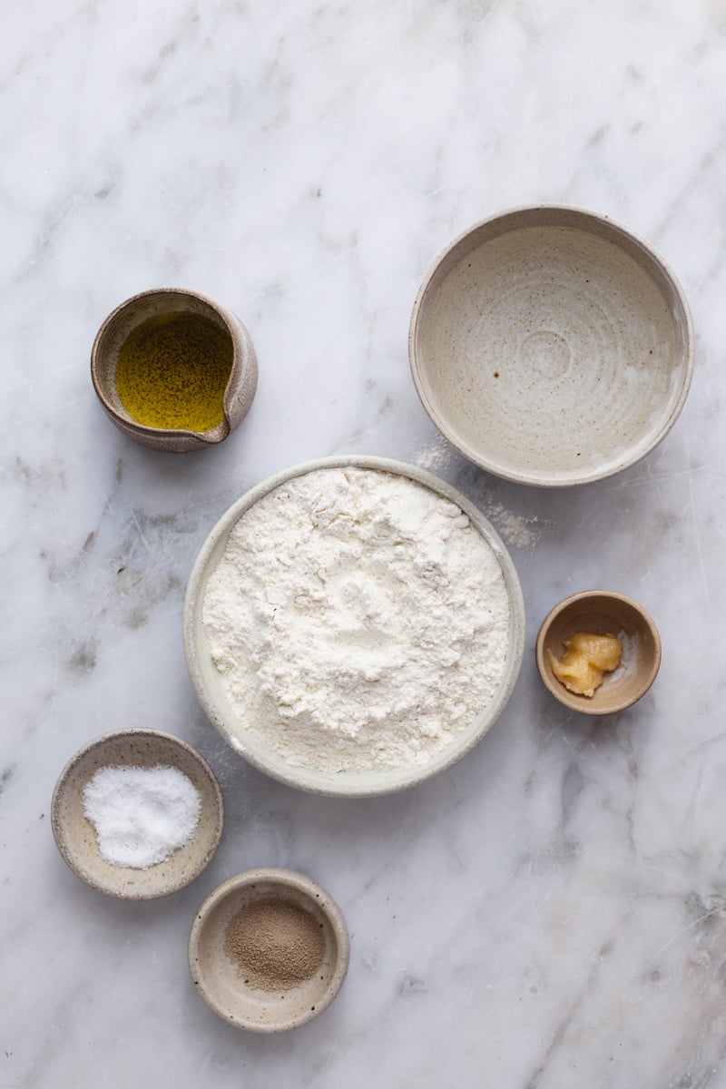 Ingredients on bowls to make the focaccia dough