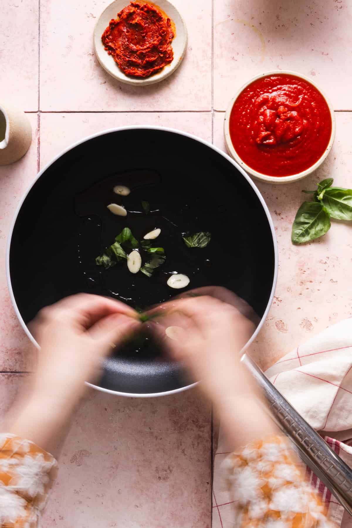 hand braking the basil leaves with the hand